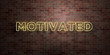 MOTIVATED - fluorescent Neon tube Sign on brickwork - Front view - 3D rendered royalty free stock picture. Can be used for online banner ads and direct mailers..