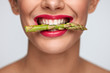 © puhhha - Healthy Diet. Beautiful Woman Mouth Holding Fresh Asparagus