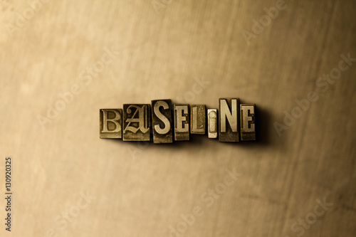 Baseline Close Up Of Grungy Vintage Typeset Word On Metal