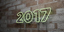 2017 - Glowing Neon Sign On Stonework Wall - 3D Rendered Royalty Free Stock Illustration.  Can Be Used For Online Banner Ads And Direct Mailers..