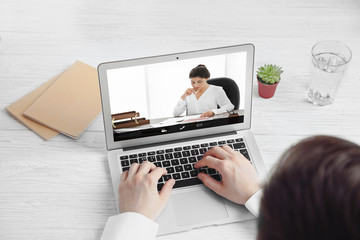 Man video conferencing with lawyer on laptop. Video call and online service concept.