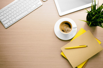 Poster - Cup of coffee with office tools on wooden background