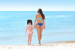 © Africa Studio - Mother and daughter having fun on beach