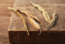 Closeup Of Haricot Bean Pods On Wooden Background