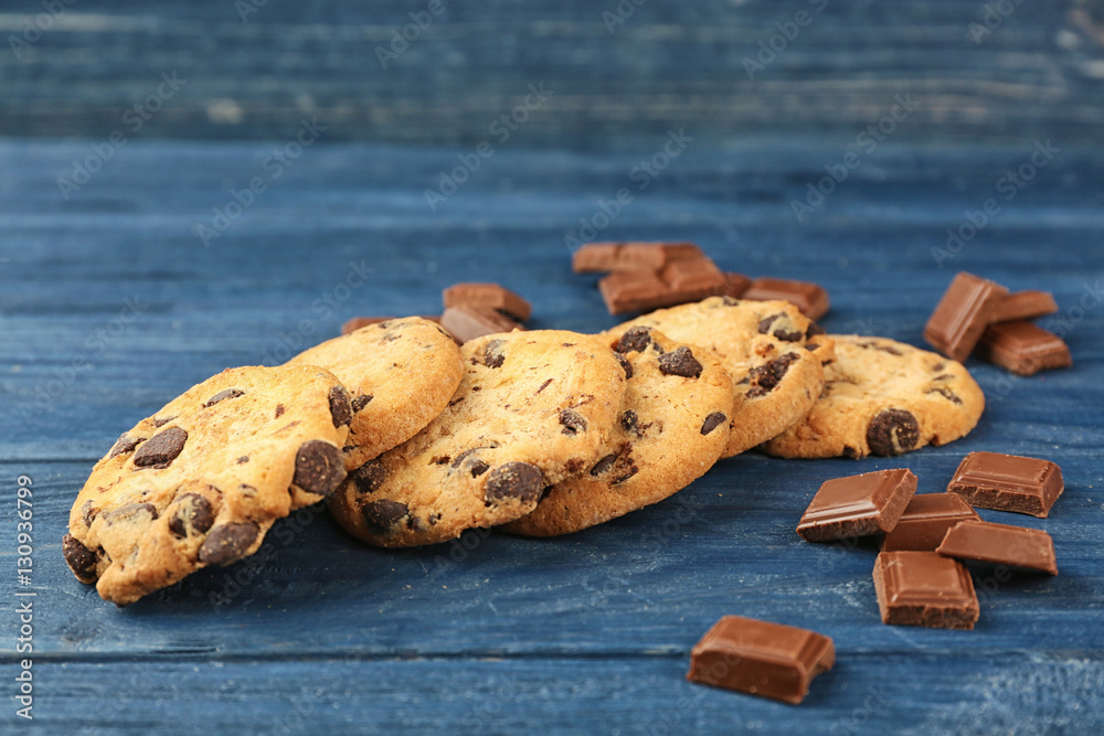 Tasty chocolate cookies on wooden table
