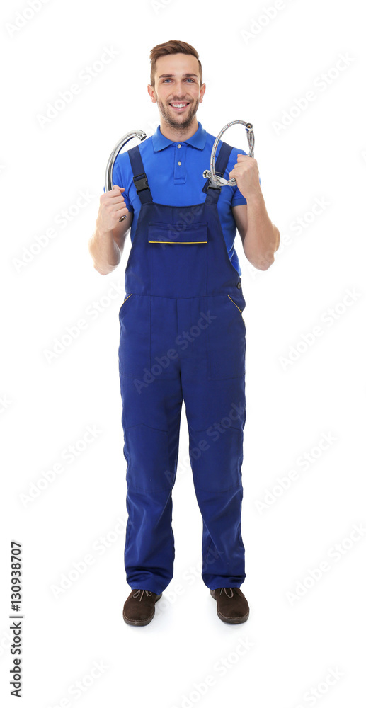 Plumber in blue uniform holding tools on white background