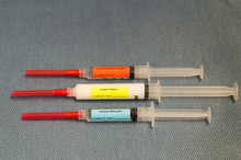 Three Syringes With Red Capped Needles Containing Anesthesia Drugs Labeled Propofol (Michael Jackson Drug), Fentanyl And Rocuronium.
Photographed With A Shallow Depth Of Field From Above.