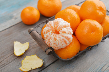 Wall Mural - Tangerines in metal basket