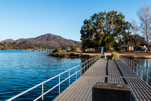 Fishing Pier At Lake Murray With Cowles Mountain In The Background In San Diego, California.  