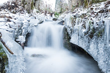 Winter Scenery Featuring A Running Creek Of Water
