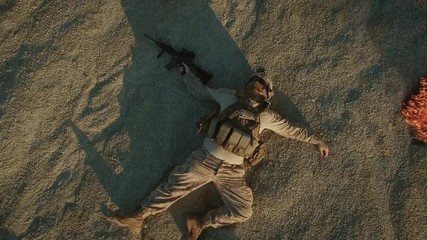 Wall Mural - Flying over Group of Dead Soldiers in Desert Area. Zooming Out. Shot in 4k (UHD)