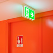 Bright green safety exit signal.