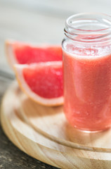 Wall Mural - Glass jar of grapefruit smoothie