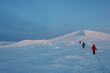 © Anna Silanteva - The people go to the top of the snow-covered mountain near Kirovsk, Murmansk region, Russiain the winter evening.