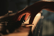 Female Hand Playing Piano