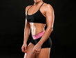 © Africa Studio - Sporty young woman on black background, closeup