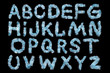 Festive alphabet made of  blue tinsel on a black background. Isolated