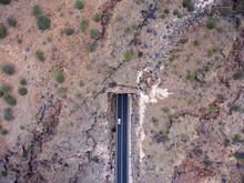 Aerial View Of Car Entering Mountain Tunnel