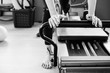 Pilates reformer exercise's detail in black and white.