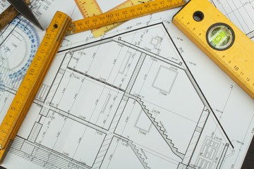 Desk project supervisor. Plans of building. Architectural project. Floor plan designed building on the drawing.
