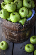 Green Apples In Wooden Basket