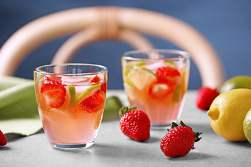 Two glasses with strawberry cocktail on table