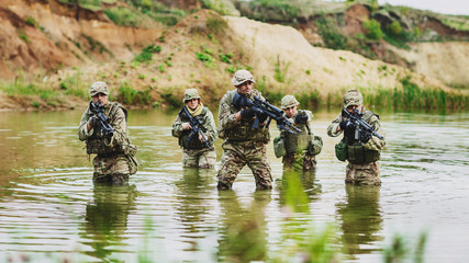 Wall Mural - special forces soldiers with weapon take part in military maneuv