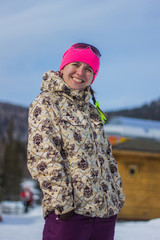 Smiling snowboarder girl