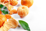 Fototapeta Na sufit - Ripe mandarin with leaves