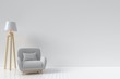 The interior has a Vertical circular sofa and lamp on empty white wall background,3D rendering