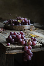 Fresh Bunch Of Red Grapes On Wooden Table