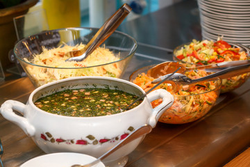 Bowls with various food in self service restaurant