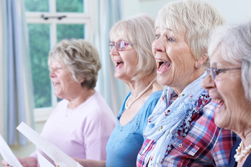 Group Of Senior Women Singing In Choir Together