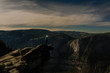 © Connect Images - Person with headlights standing on edge of canyon, Yosemite National Park, California, USA