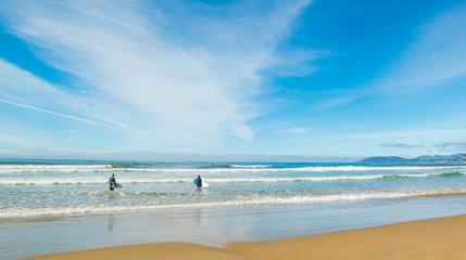 Wall Mural - Surfers in Pismo Beach