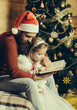 © Volodymyr - christmas bearded father and girl reading