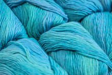 Many Skeins Of Blue Yarns Are Lying Next To Each Other. Beautifully Photographed With A Diagonal Composition.