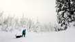 Backcountry Snowshoe with black dog