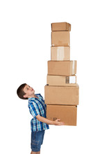 Boy Struggling With Tower Of Boxes