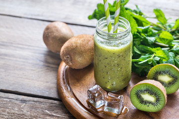 Wall Mural - Glass jar of kiwi smoothie