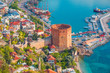Landscape with marina and Kizil Kule tower in Alanya peninsula, Antalya district, Turkey