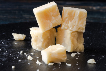 Wall Mural - White Cheddar Cheese Cubes on a Black Slate