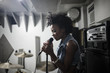 © HEX - Young female singer performing in studio