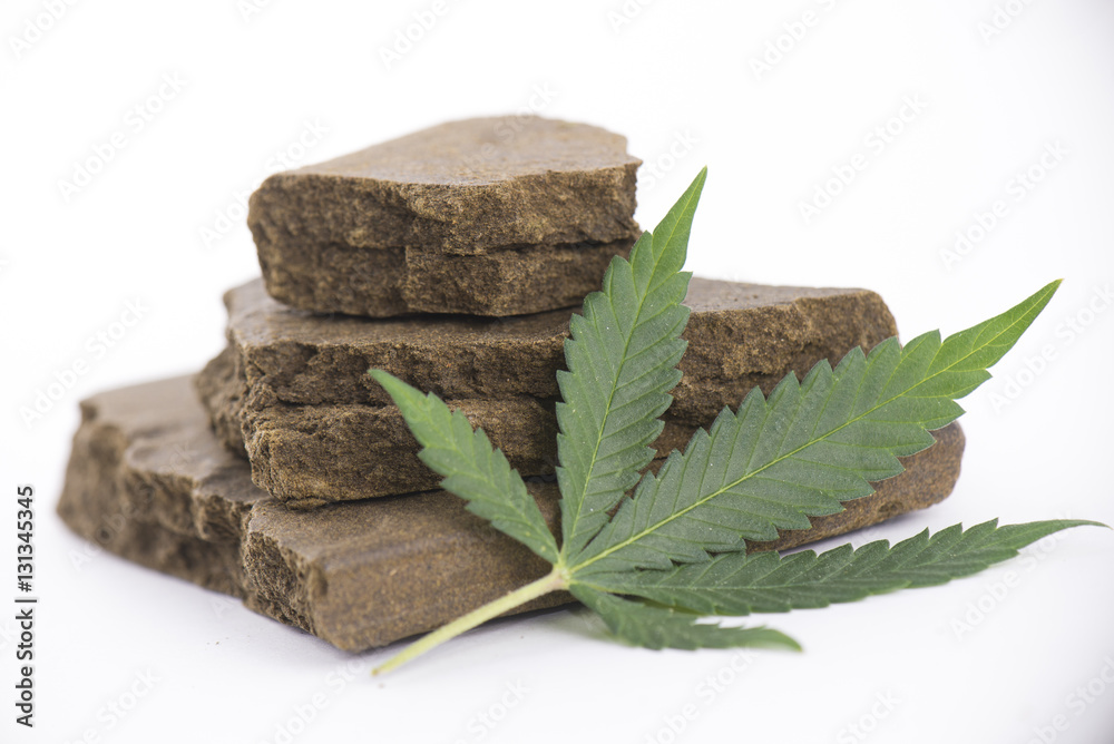 Blocks of hashish, a medical marijuana concentrate isolated with - obrazy, fototapety, plakaty 