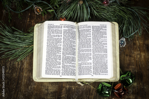 Open bible with bells and flowers Christmas Theme - Buy this stock photo and explore similar