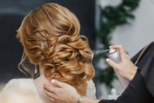 Master Stylist Makes The Bride Wedding Hairstyle Using Spray Lac