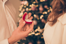 Close Up Of Young  Man Making Proposal Of Marriage On Christmas