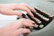 © Sensay - Hands writing on old typewriter