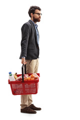 Poster - man with a shopping basket full of groceries waiting in line