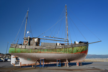 old wooden sailing vessel on supports